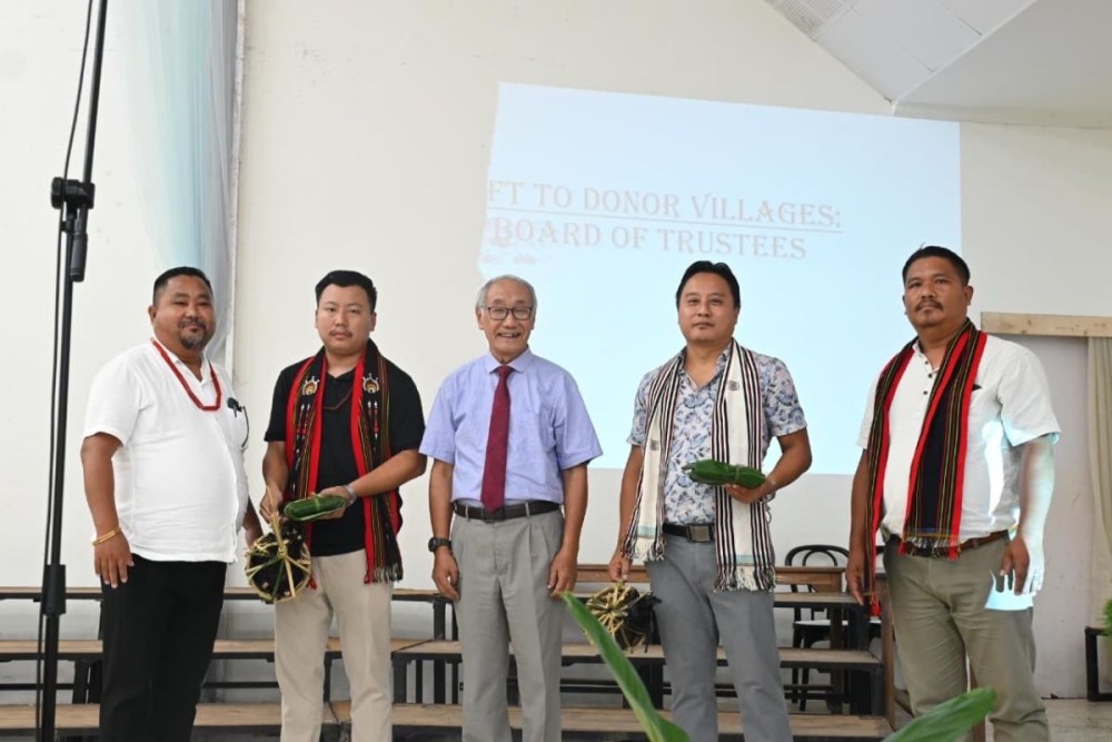 Members of the donor villages Chümoukedima and Seithekema accepting the customary gift of rooster and salt as part of the Angami tradition during the 51st Foundation Day celebration of the Pataki Christian College (Autonomous) at the Bundrock Chapel Auditorium on August 28. (Photo Courtesy: PCC Mass Comm)