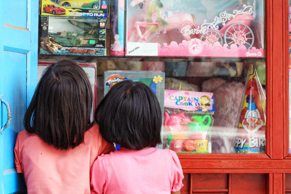 Caught unaware, two young girls are seen admiring toys at a shop in Mokokchung. Recent incidents involving school children in a gang fight have raised questions on how important good parental care and guidance is for the development of the youth and the mend of a society. (Sorei Mahong/Photo)
