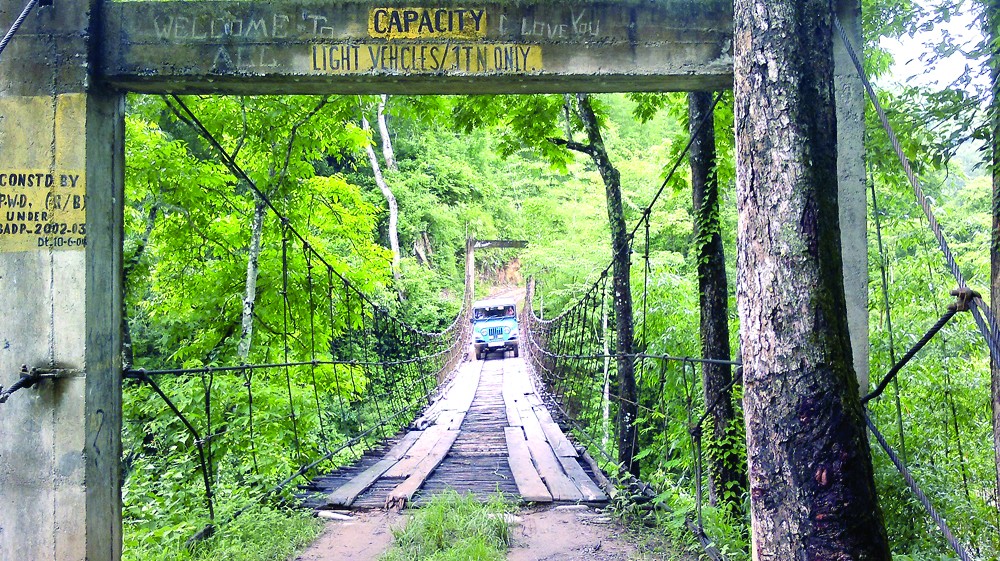 A jeep crosses the hanging bridge over the Zungki River on the way to Pungro via-Tethezu in Kiphire district of Nagaland. (Morung photo)