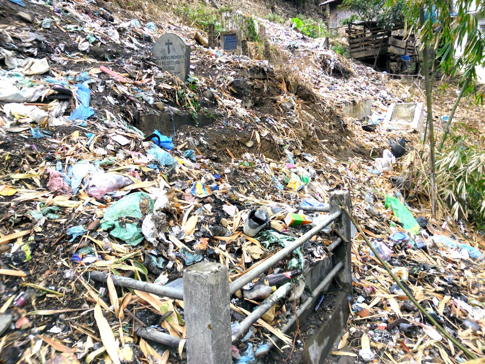 Heaps of trashes dumped by residents at a Cemetery in Kohima.
