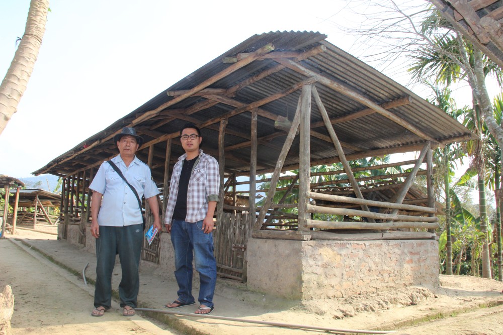 Imtijungshi Pongen along with his son at their piggery farm at Aliba village. Imtijungshi Pongen, a former PHED work-charged employee left his job to start the piggery. Today his farm investment stands at lakhs of rupees. (Photo by Taliakum Pongen)