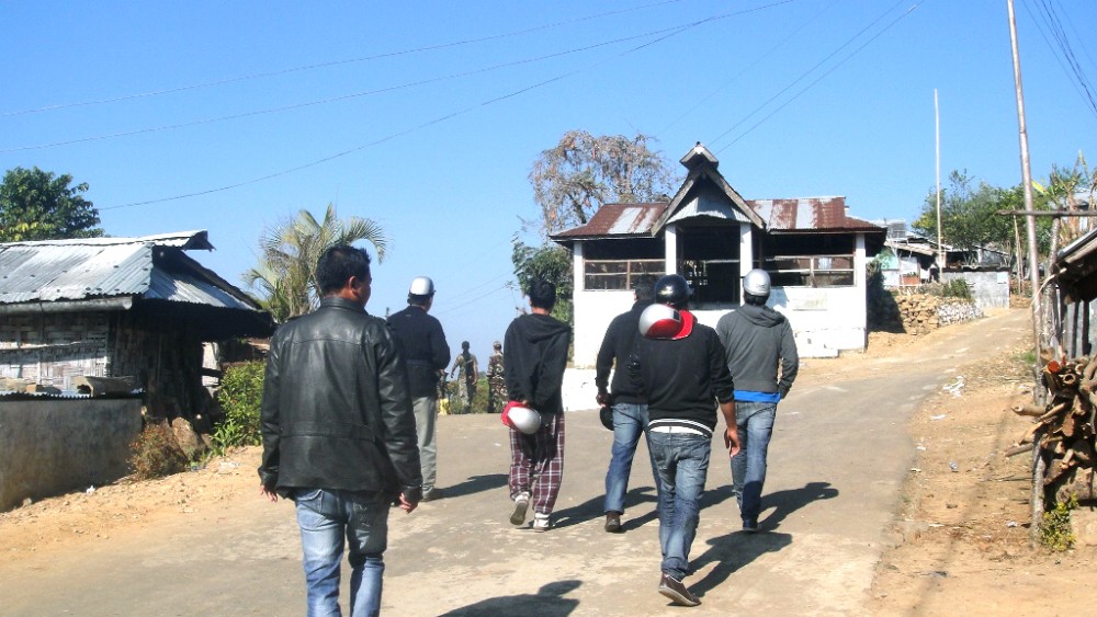 Supporters of a political party are seen here with helmets to protect their head from stones and rocks that are hurled and catapulted at them by the opposition. (Morung Photo)
