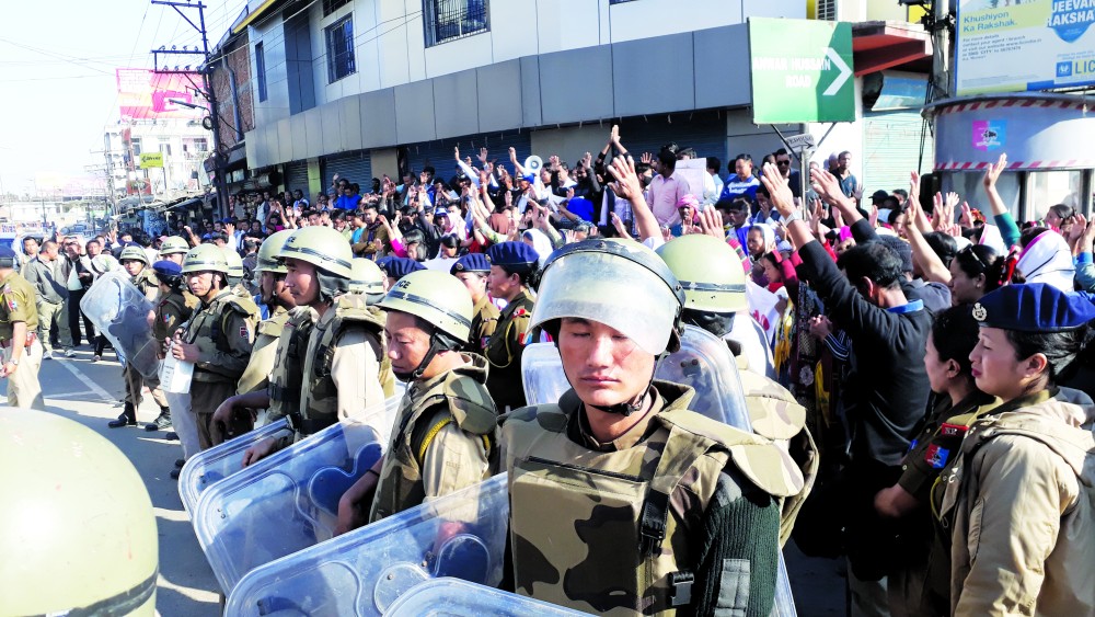 Protestors at an anti-corruption rally organized by ACAUT in connection to a PDS scam are seen surrounded by police in full riot gear at Kher Mahal police point, Dimapur on December 15 (File photo)