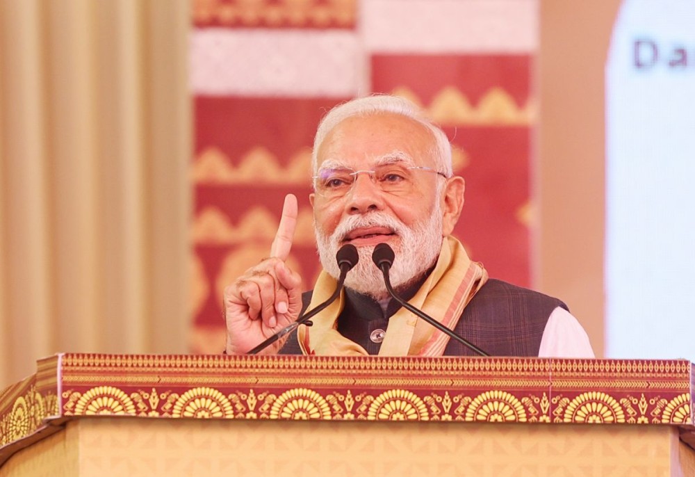 Darrang: Prime Minister Narendra Modi addresses the audience during the laying of the foundation stone and inauguration of the multiple development works during a public programme in Darrang, Assam, on Sunday, September 14, 2025. (Photo: IANS/PMO)