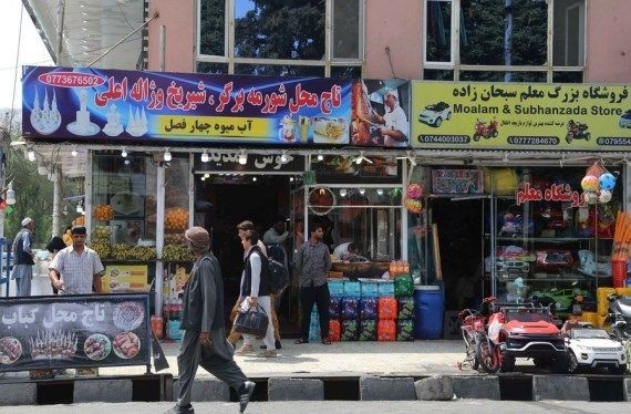 People line up in front of a bank in Kabul, capital of Afghanistan. (Kabir/Xinhua/IANS File (Photo )