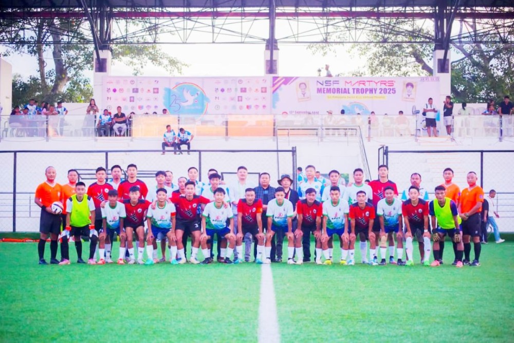 Meguo Ratsa and other officials with the players of Jakhama Youth Organization and Patkai Christian College on September 29.