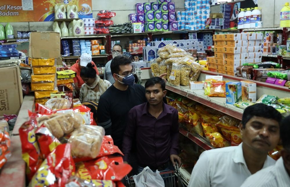 People buying grocery in mass quantity to store at home during to avoid mass gathering in daily life after Coronavirus scare, in New Delhi.(IANS File Photo)