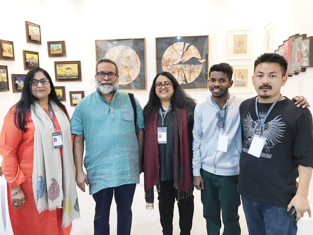 H. Akup Buchem (extreme right) with others during his art exhibition held at Indian art fair in Delhi from February 2 to 5.