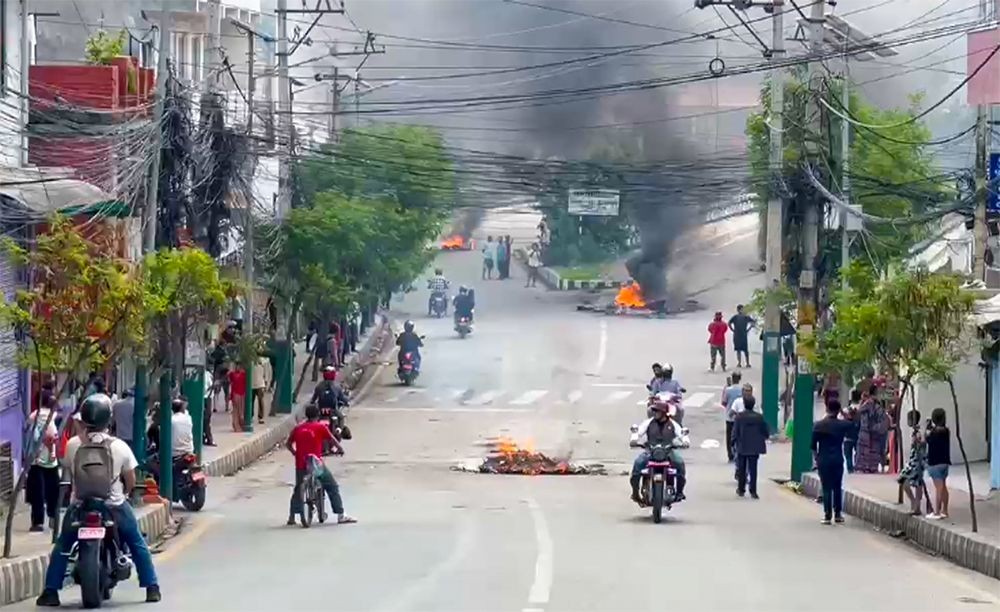 Kathmandu: People set tyres on fire during a protest against corruption and the government’s ban on social media platforms in Kathmandu, Nepal, on Tuesday, September 9, 2025. (Photo: IANS)