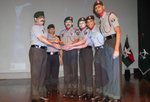 Brigadier Chandan Singh Pathania, Commandant, ARTC&S presents the trophy to the Assam Rifles, the overall champion team of the North East Zone Inter CAPF Debate Competition on Human Rights held at Shokhuvi on September 15. (Photo Courtesy: ARTC&S)