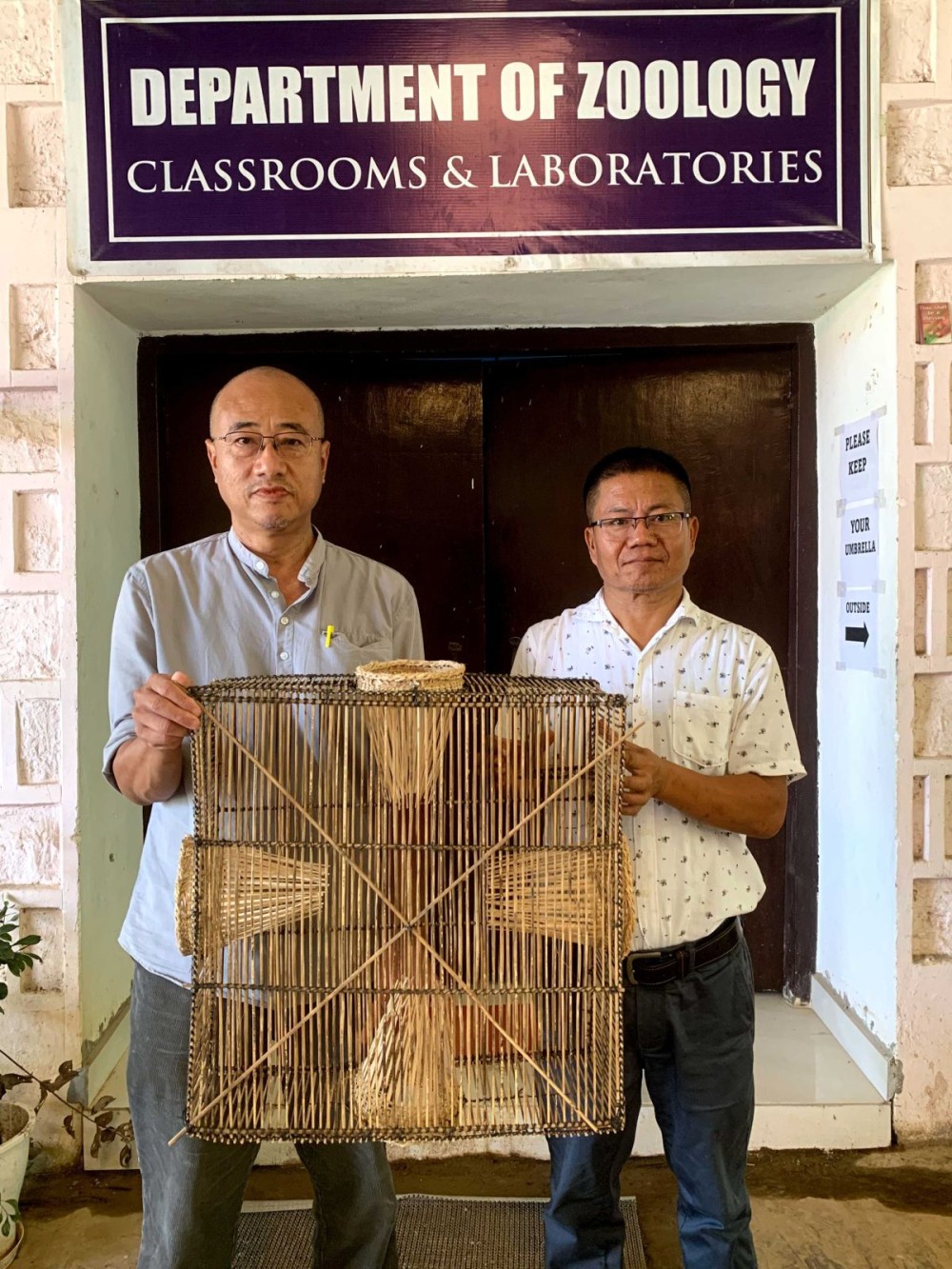 Prof Bendang Ao & Assistant Professor Dr Pukhrambam Rajesh Singh of NU’s Department of Zoology  pose with the ‘BR Fishing Trap’.