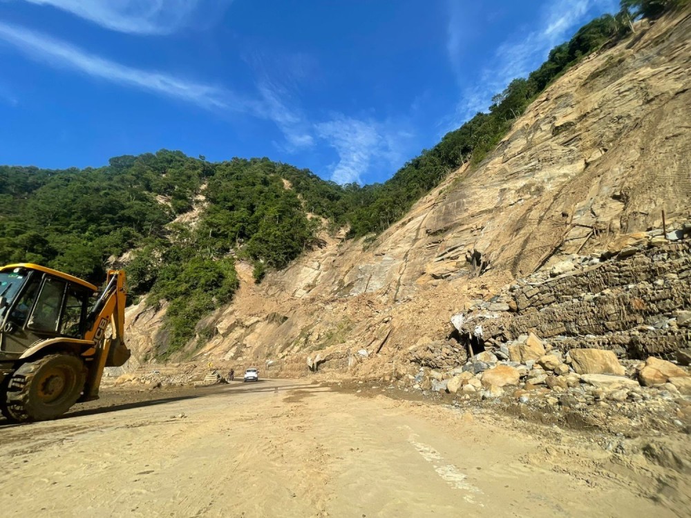 An excavator clears debris and smoothens the roads in the landslide-, rockfall-, and soil erosion-affected Chainage 126 section of the Tsiedukhru Range stretch of National Highway H-29 on September 28. The NH-29 four-lane, as well as other road construction works in Nagaland, have been affected by various natural challenges. Among others, experts have called for a dedicated State Landslide Policy to address these challenges. (Morung Photo)