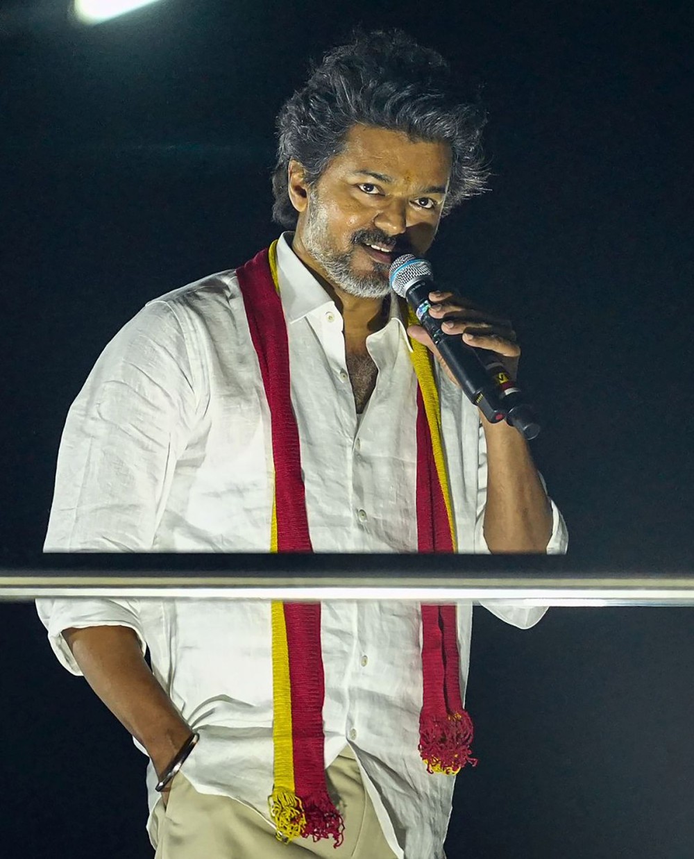 Karur: Tamilaga Vettri Kazhagam (TVK) chief and actor Vijay delivers a speech during a road show in Karur on Saturday, September 27, 2025. (Photo: IANS/TVK)