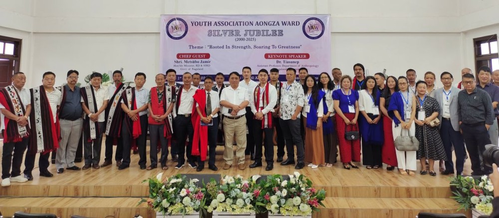 Chief guest Metsübo Jamir, Minister for Rural Development & SIRD, GoN, along with keynote speaker Dr. Tiasunep, officials, and members of the Youth Association Aongza Ward (YAAW) during the Silver Jubilee celebration held at Aongza Ki, Mokokchung, on October 1. (Morung Photo)