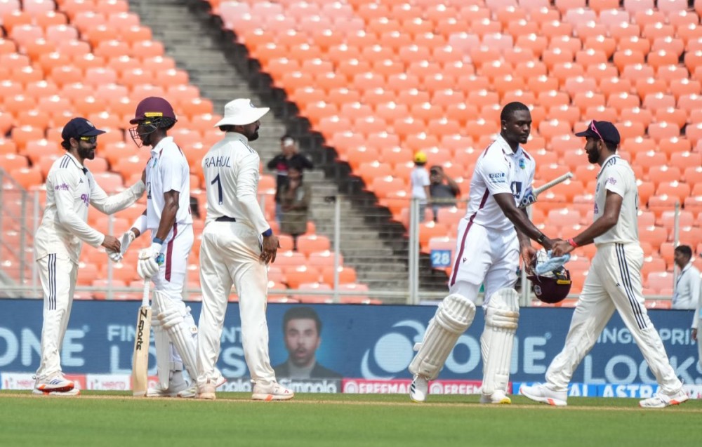 Ahmedabad: Indian and West Indies players greet each other on the field at the end of the first Test match in Ahmedabad on Saturday, October 4, 2025. (Photo: IANS)
