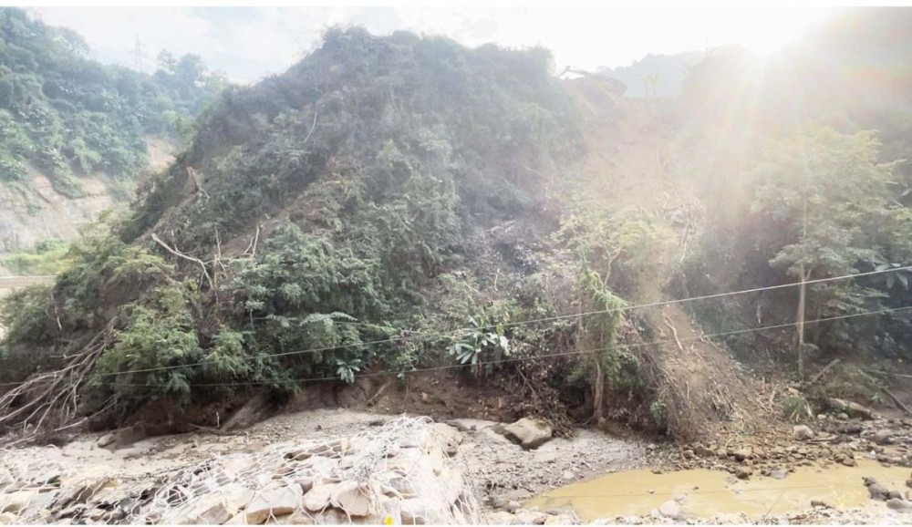 An excavator is seen working atop the Chathe riverbank at the Tsiedukhru Range stretch of National Highway-29 on October 29. The area, prone to frequent soil erosion, is being cleared to manage the river’s flow. (Morung Photo)