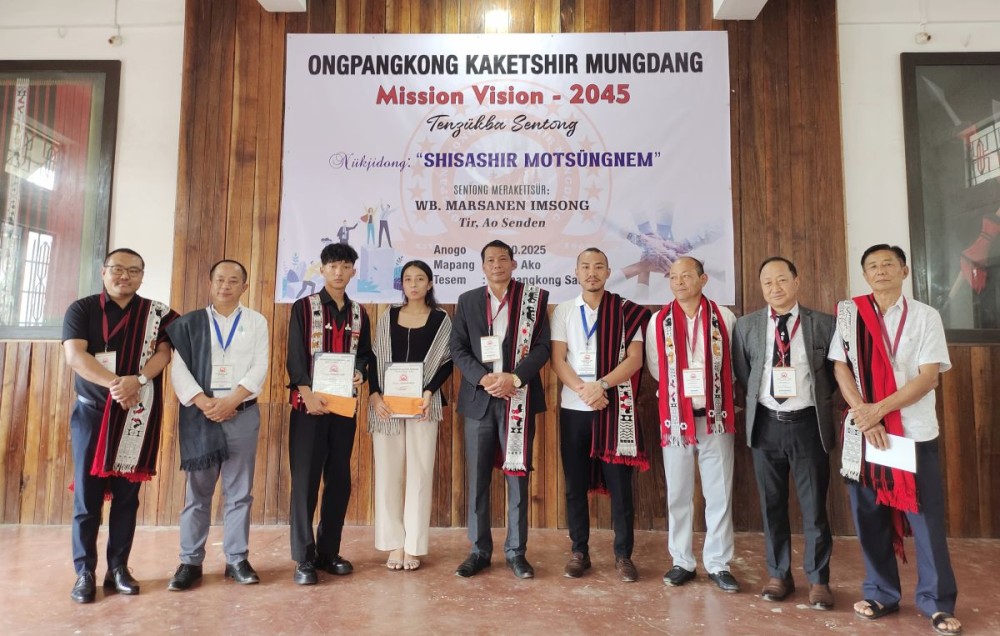 Officials, dignitaries, and student recipients of the OKM Mission Vision 2045 pose for a group photograph after the launch programme held at Ongpangkong Salang, Mokokchung, on October 26. (Morung Photo)