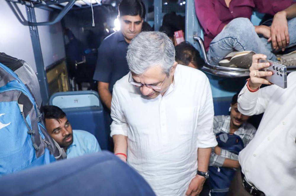 New Delhi: Union Railways Minister Ashwini Vaishnaw interacts with passengers at New Delhi Railway Station on Saturday, October 18, 2025. (Photo: IANS)