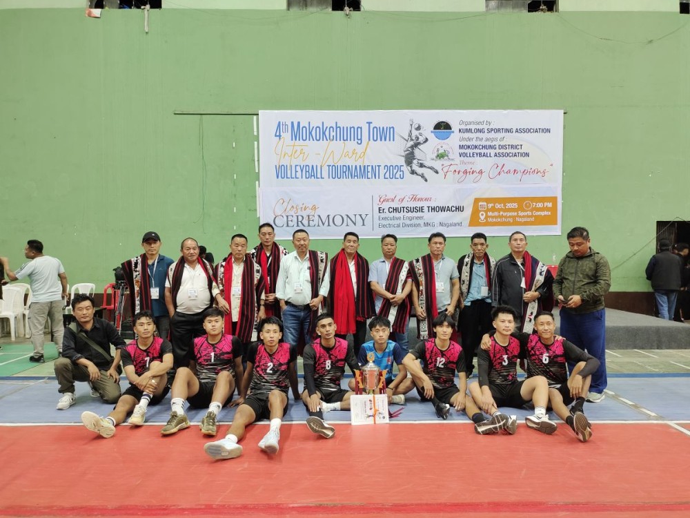 Kumlong Ward players and officials celebrate after lifting the 4th Mokokchung Town Inter-Ward Volleyball Tournament 2025 trophy at the Multi-Purpose Sports Complex, Mokokchung, on October 9. (Morung Photo)