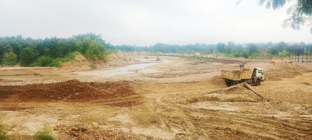 Trucks are seen transporting boulders extracted from the Chathe River. (Morung File Photo: For Representative Purposes Only)