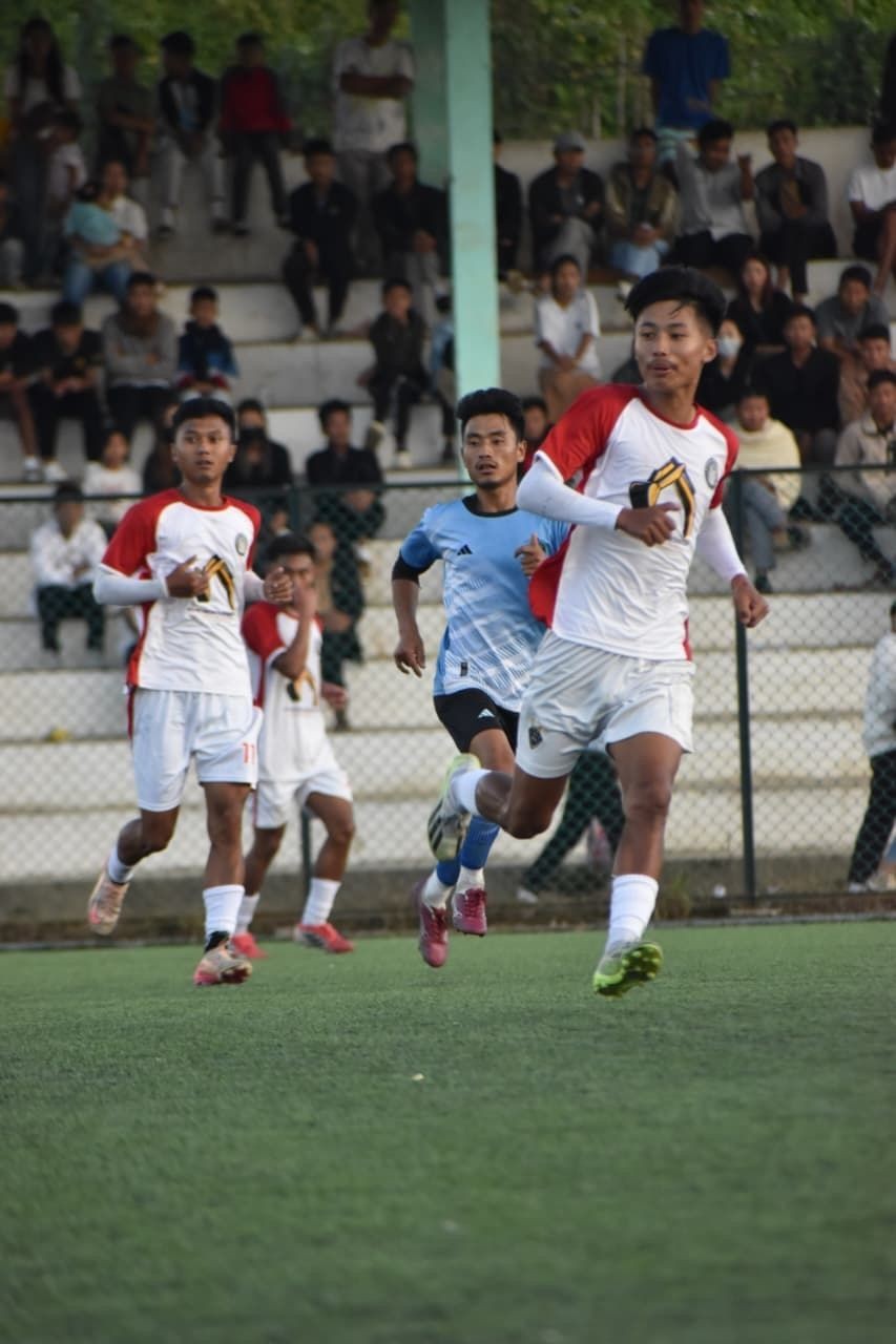 Shanen FC and Khiamniungan Sports Council (blue) in action at the ongoing 33rd Loyem Memorial Trophy at Loyem Memorial Astro Turf, Tuensang on November 8.