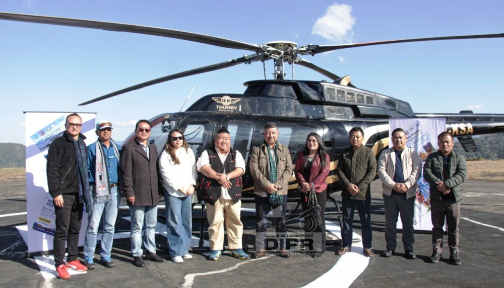 Minister Temjen Imna Along with others during the flagging off of Aerial Experience Rides - Helicopter Service for the upcoming Hornbill Festival 2025 at Lerie Helipad, Kohima on November 25. (DIPR Photo)