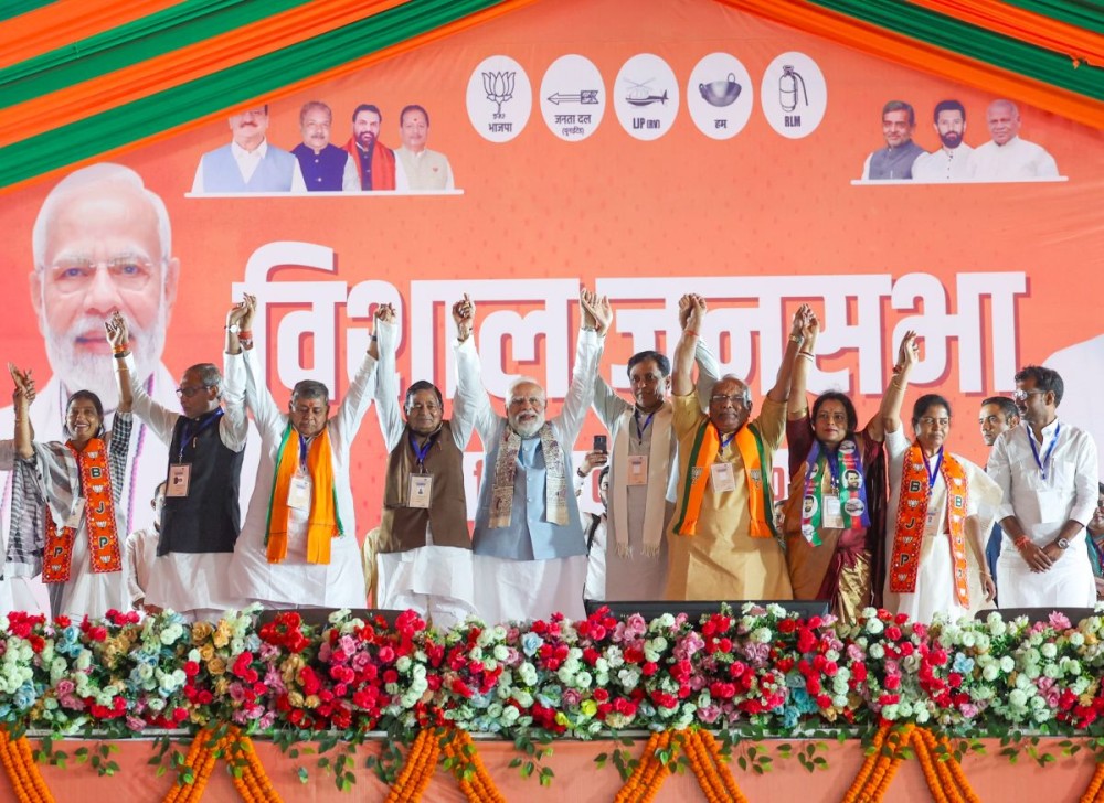 Katihar: Prime Minister Narendra Modi joins hands with leaders during a public rally in support of the NDA candidates for Bihar Assembly elections, in Katihar, Bihar on Monday, November 3, 2025. (Photo: IANS/PMO)