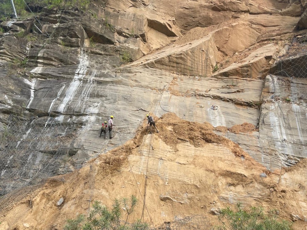 Workers are seen repairing damaged rockfall protection barriers along NH-29 Tsiedukhru Range in this file photo taken October 29, 2025. (Morung File Photo)