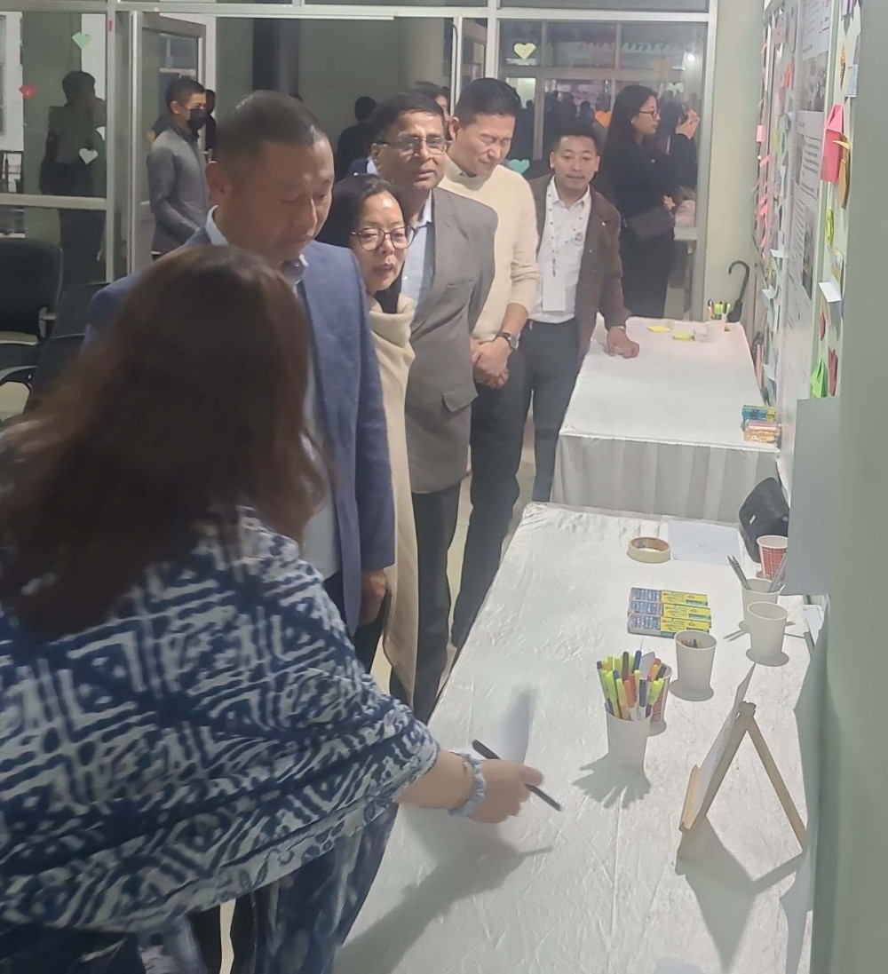 DoSE Advisor Dr Kekhrielhoulie Yhome going through Art Exhibition in Kohima on November 6. (Morung Photo)