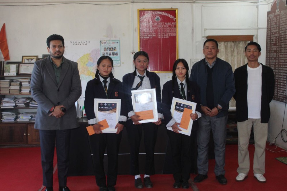 DC Zunheboto Dharam Raj, IAS along with the winners of the essay competition and others on November 18. (Morung Photo)