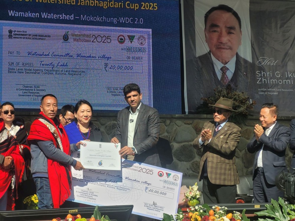 MoS Dr Pemmasani Chandra Sekhar hands over Watershed Janbhagidari Cup 2025 award during the launch of Watershed Mahotsav 2025 in Kohima on December 8. (Morung Photo)