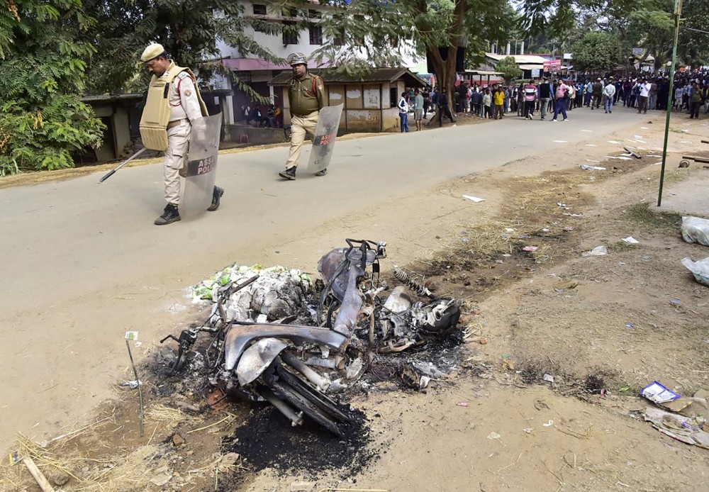 A damaged motorcycle is seen following violence that rocked Kheroni town and adjoining areas of Assam’s West Karbi Anglong district, allegedly triggered by rumours and misinformation linked to the treatment of hunger-striking protesters, in Kheroni on Monday, December 23, 2024. (IANS Photo)