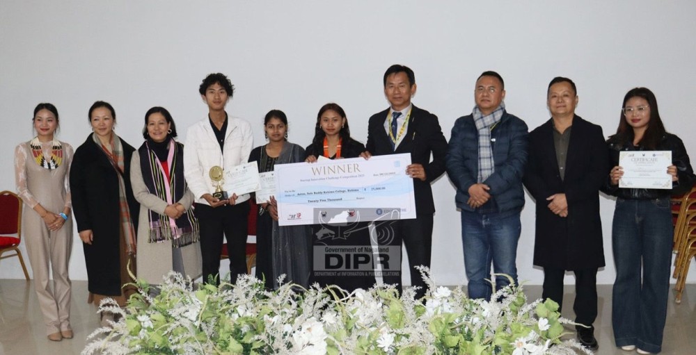 Director, Industries and Commerce, P Tokugha Sema with winner of the Startup Innovation Challenge Competition 2025 at Handloom & Craft Pavilion, Naga Heritage Village, Kisama on December 8. (DIPR Photo)