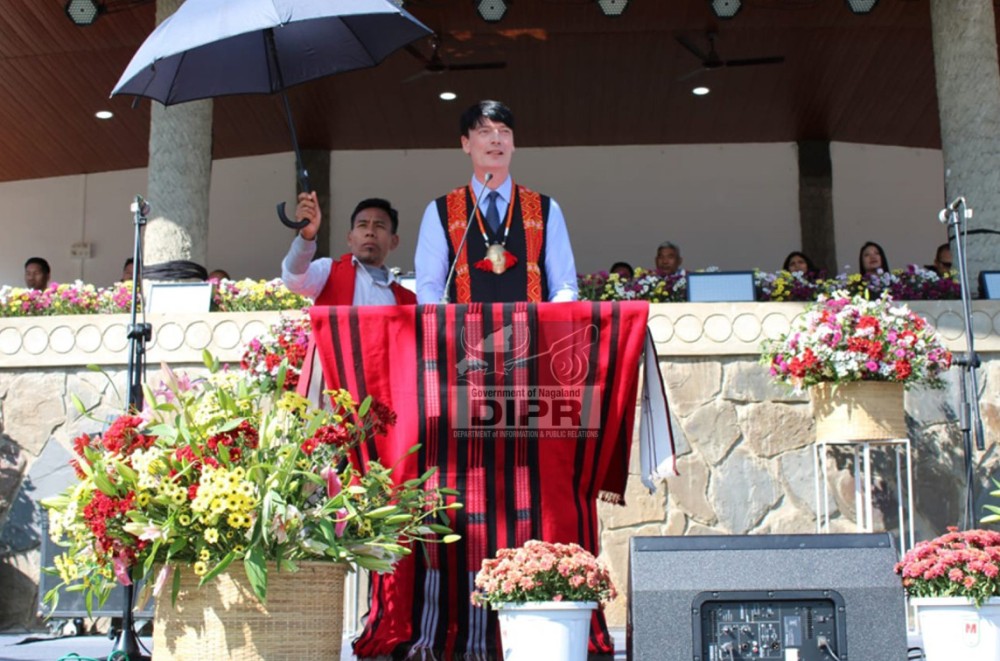 Deputy Ambassador, Embassy of Ireland, Raymond Mullen addressing during the International Hornbill Festival Mon Edition 2025, at Konyak Heritage Complex, Mon on December 9. (DIPR Photo)