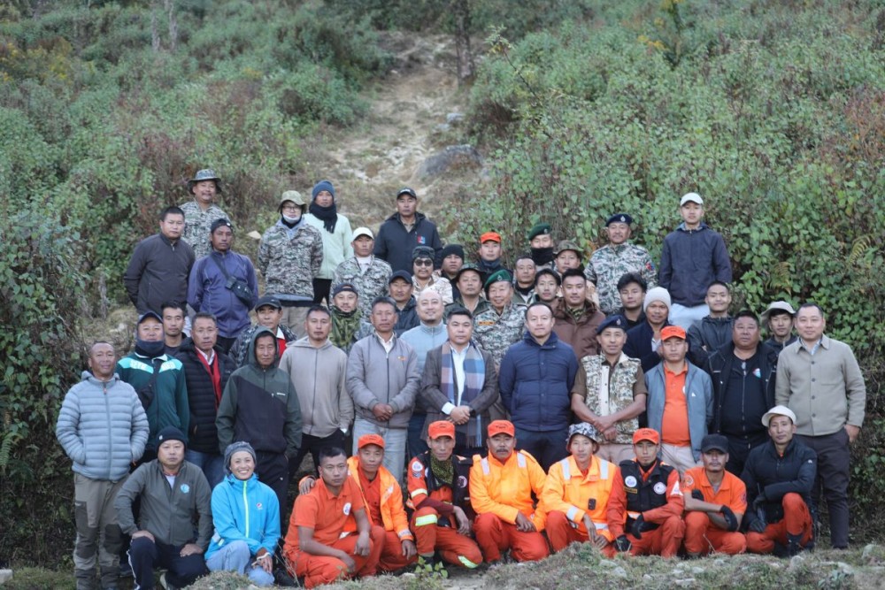 DC Kohima, B Henok Buchem, officials, and the team engaged in combating the Dzükou fire at the base camp in Khonoma on December 15. (DIPR Photo)