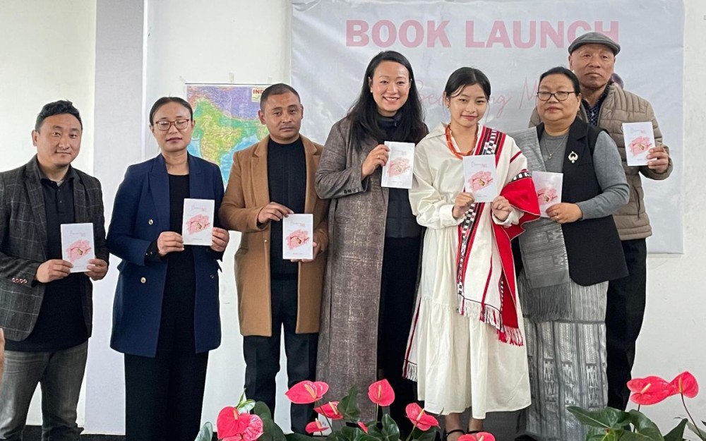 Author Mutsolu Z Lohe with others during the book launch at CUE Academy in Kohima on December 6.