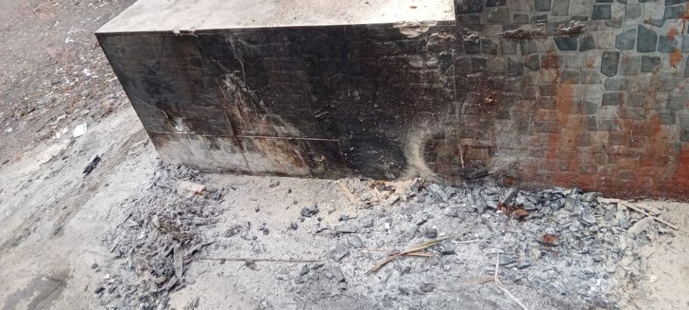 Burnt plants and a damaged garden wall at the Jubilee Tower public utility centre near New Market junction on NL Road.