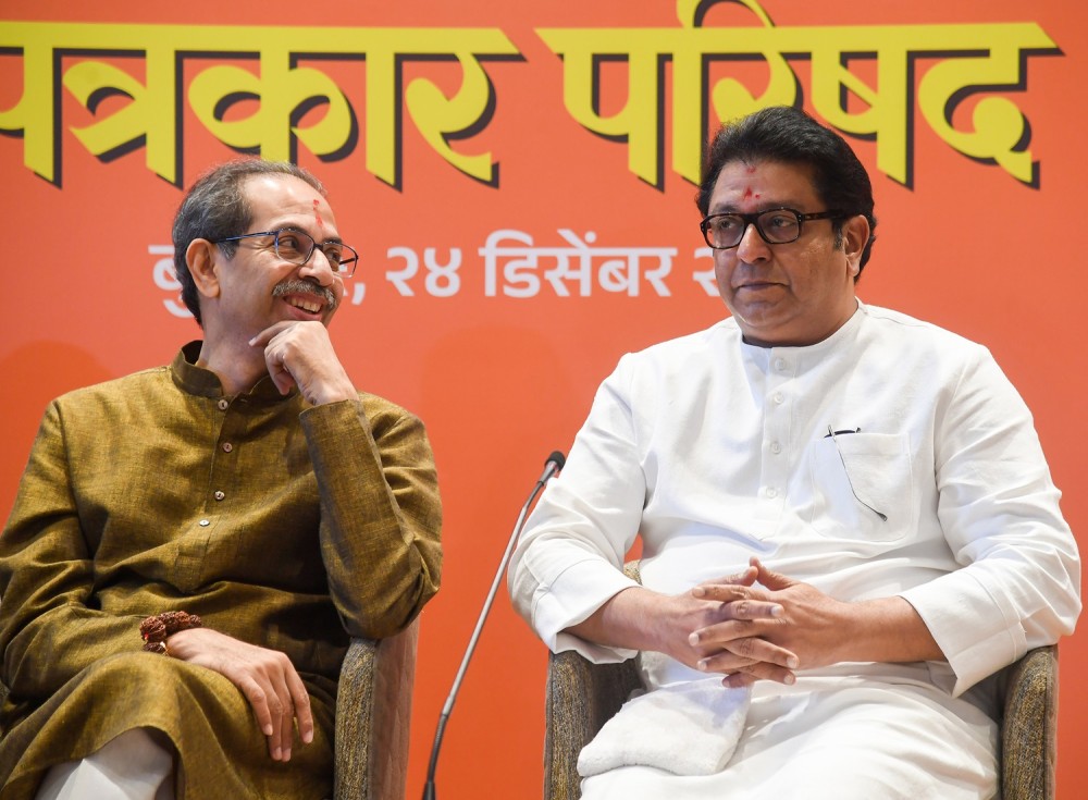 Mumbai: Shiv Sena (UBT) chief Uddhav Thackeray and Maharashtra Navnirman Sena (MNS) President Raj Thackeray address a press conference to announce their alliance for the upcoming BMC polls in Mumbai on December 24. (IANS Photo)