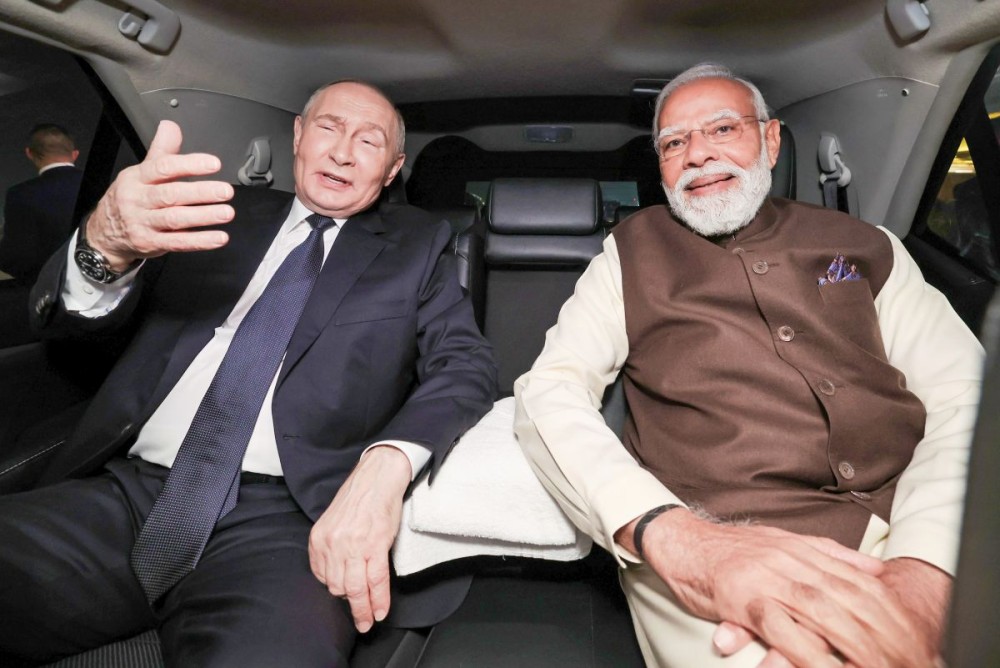 Prime Minister Narendra Modi and Russian President Vladimir Putin travel in the same car as they depart from the Palam Technical Area following the Russian President’s arrival, in New Delhi on  December 4, 2025. (IANS/PMO File Photo)