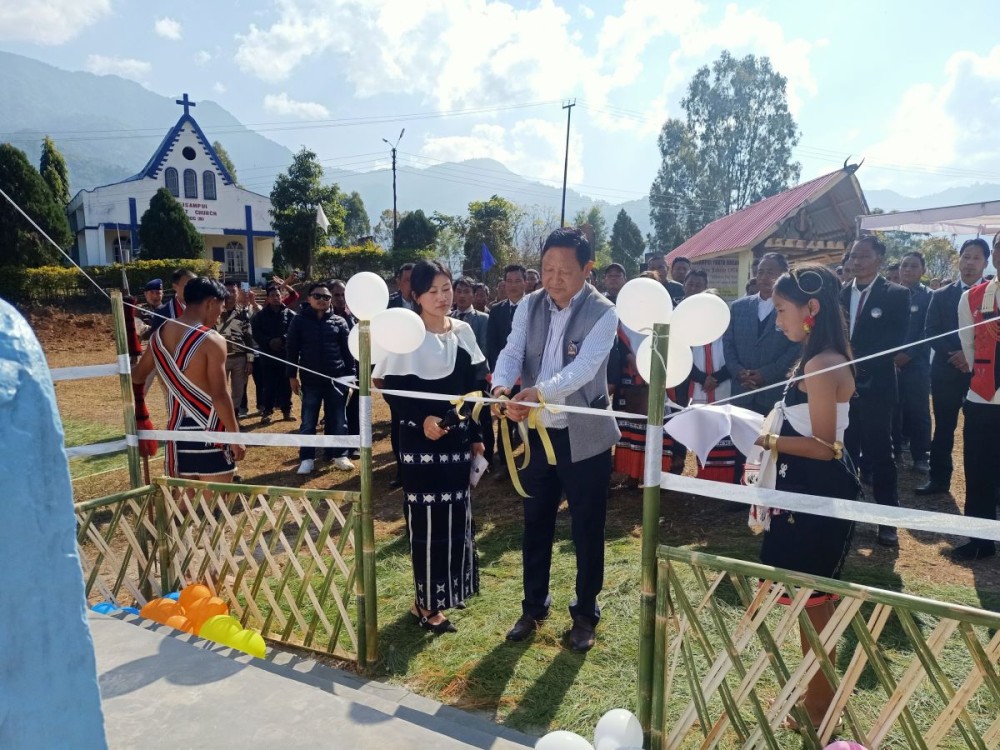Namri Nchang cuts open the ribbon during the Golden Jubilee celebration of the BYO at Beisumpui village in Peren on January 14.
