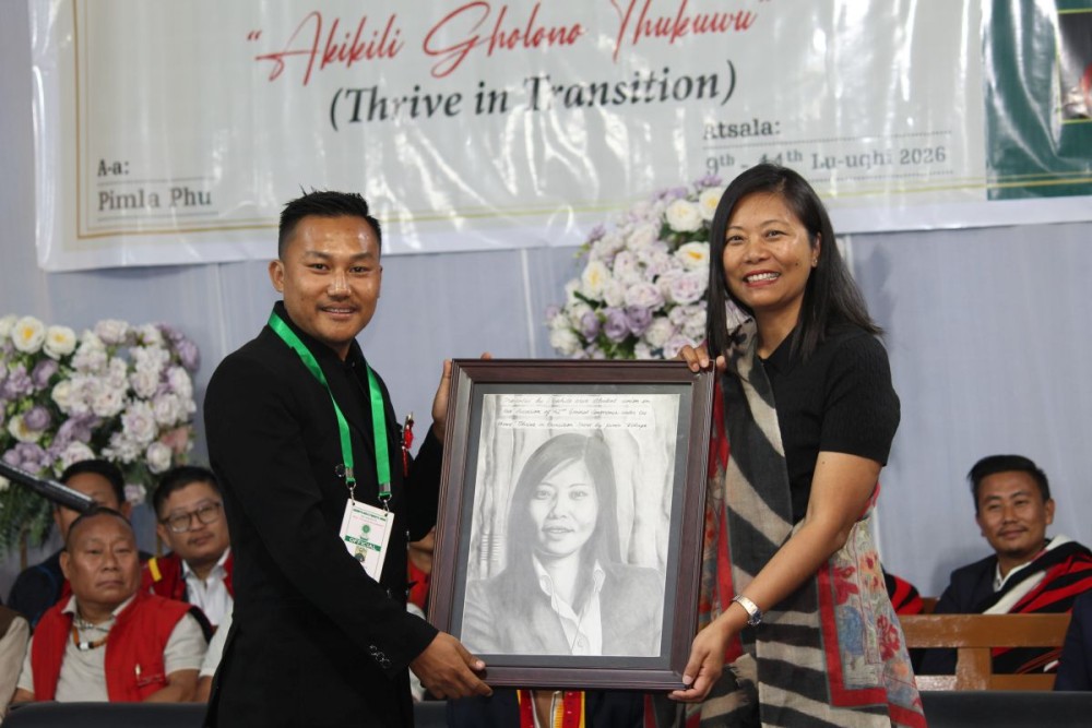 MLA Hekani Jakhalu receives a portrait from the president of the AASU N Sumika Swu during the 42nd AASU biennial conference in Pimla village on January 11. (Morung Photo)