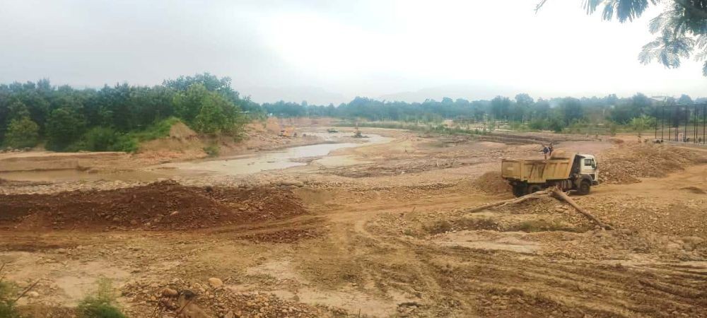 Trucks are seen transporting boulders extracted from the Chathe River. (Morung File Photo: For Representative Purposes Only)