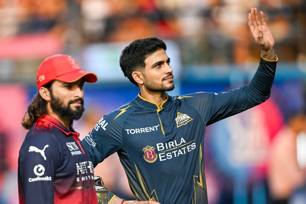 Royal Challengers Bengaluru's captain Rajat Patidar and Gujarat Titans' captain Shubman Gill during the toss ahead of the Indian Premier League (IPL) 2026 Qualifier 1 match at the HPCA Stadium in Dharamshala on May 26. (IANS Photo)