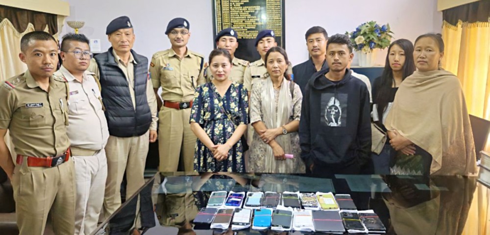 Police officials along with the owner of the stolen mobile phones in Kohima on May 28. (Photo Courtesy: Kohima Police)