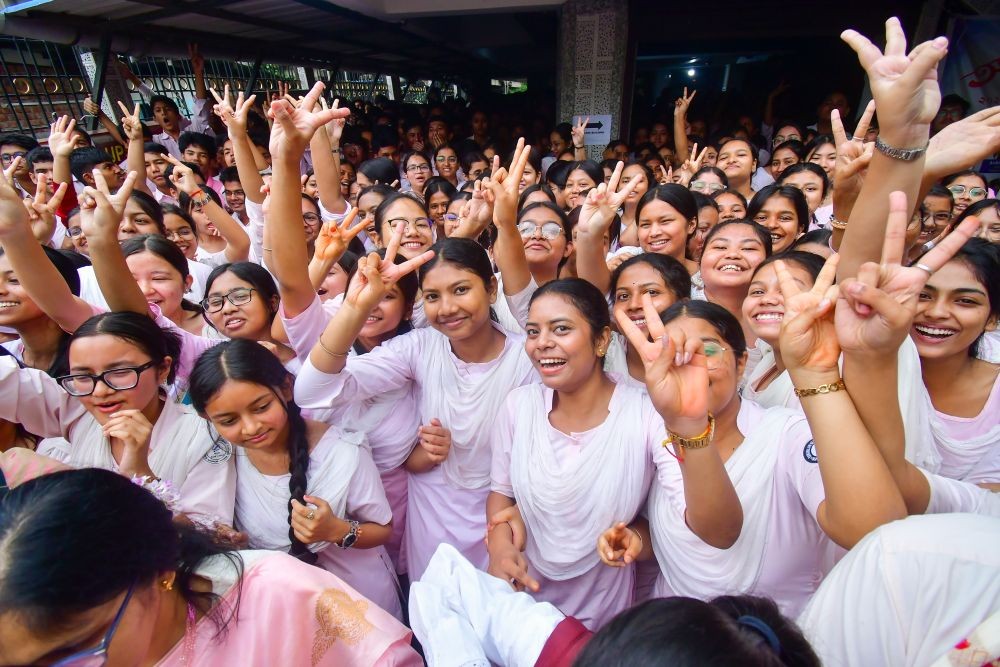 Students of Ramanujan Senior Secondary School celebrate after the declaration of the Assam Higher Secondary Education Council (AHSEC) Class 12 examination results, in Nagaon, Assam on April 28, 2026. (IANS Photo)