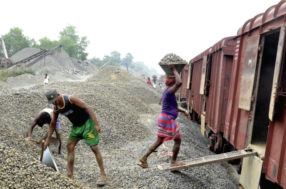 Workers load stone chips into a freight wagon at a station under Northeast Frontier Railway. According to an official release, a total of 1,684 wagons of stone chips were transported from various stations across the railway zone, including Sukhovi,  in April. (Photo Courtesy: CPRO, NFR)