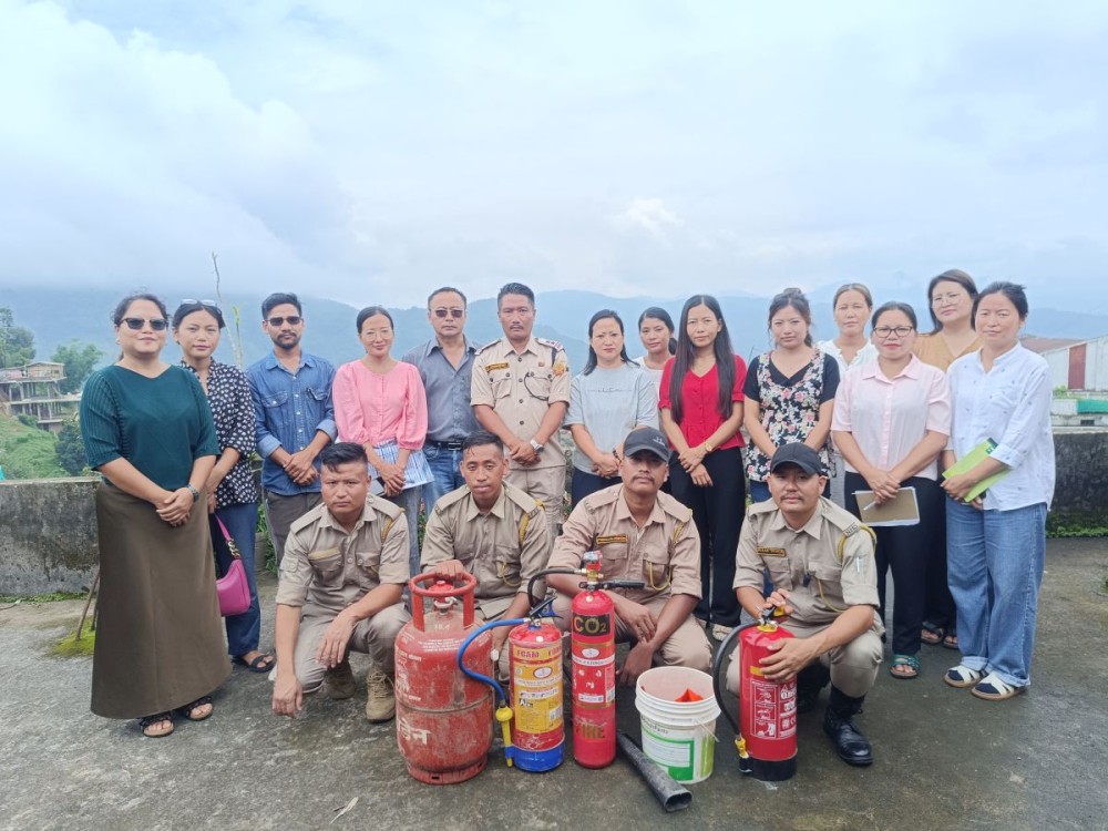 Healthcare personnel attending the NQAS implementation workshop pose for a group photograph with Fire and Emergency Services personnel following a fire safety demonstration in Mon on June 12.