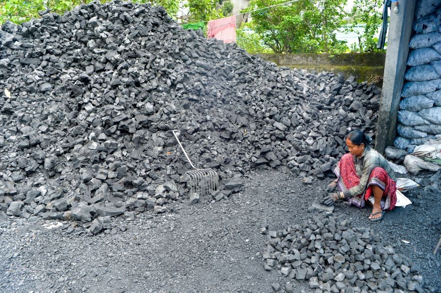 A woman worker at work at a coal depot on the eve of International Workers' Day, in Siliguri on April 30, 2026. (IANS Photo)