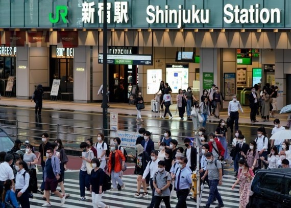 Pedestrians walk across a street in Tokyo, Japan on July 8, 2021. (Christopher Jue/Xinhua/IANS File Photo)