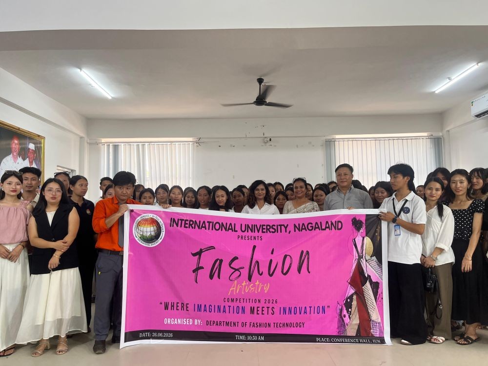 Participants, faculty members and officials pose for a group photograph during the Fashion Artistry Competition 2026 organised by the Department of Fashion Technology, International University, Nagaland, at the university's conference hall on June 26.